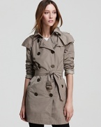 Master utilitarian city style in this Burberry Brit trench coat, finished with a generous hood to halt a bad hair day before it starts.