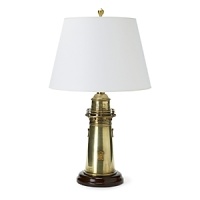 Fashioned after an old lighthouse, this lamp in natural brass gives some wanted maritime flare to any room. Fashioned after an old lighthouse, this lamp in natural brass gives some wanted maritime flare to any room.