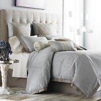 Elegant, all-over embroidered scroll pattern with contrasting flange for duvet and shams.