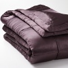 Luxurious 100% silk quilt is accented with a tufted border, reversing to cotton sateen. Solid quilted sham.