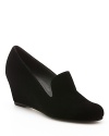 Smoking loafer looks on a sleek wedge heel define this Stuart Weitzman style.