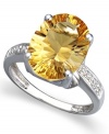 A bold burst of sunshine. Brighten any day when you don the warm tones of this oval-cut citrine ring (5-1/6 ct. t.w.). Round-cut diamond accents and a 14k white gold band add to the elegance.