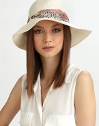 Soft linen, in a floppy style accented with a printed, ruched band of chiffon.Ruched chiffon bandBrim, about 3LinenHand washMade in USA of imported fabric