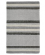 Linear designs are accented with exotic faux silk to create a timeless palette in the Sahara area rug from Calvin Klein. Crafted by skilled artisans in India, it features generously thick wool and viscose fibers woven to create remarkable strength and impeccable elegance.