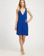 A simple V-neck shift of supple silk chiffon, finished with a bold colorblock back.V necklineSleevelessShirttail hemV-back with center ruchingAbout 20 from natural waist93% silk/7% elastaneHand washImported
