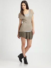 Elegant semi-sheer top with short dolman sleeves and ultra-fitted silhouette. ScoopneckShort dolman sleevesRibbed hemLonger length hits below the hips70% alpaca/30% bamboo fibersDry cleanImportedModel shown is 5'9 (175cm) wearing US size Small. Elegant semi-sheer top with short dolman sleeves and ultra-fitted silhouette. ScoopneckShort dolman sleevesRibbed hemLonger length hits below the hips70% alpaca/30% bamboo fibersDry cleanImportedModel shown is 5'9 (175cm) wearing US size Small.