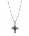 Symbolic style with a hint of color. Vatican pendant features an intricate cross decorated with round-cut clear crystals and a square-cut blue crystal center. Setting and chain crafted in silver tone mixed metal. Approximate length: 16 inches + 3-inch extender. Approximate drop: 1-1/4 inches.