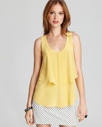 This Cynthia Steffe blouse works its feminine charm with a lemony hue and flouncy silhouette.