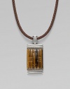 A stunning dogtag pendant is designed in fine silver with basketwoven tiger's eye and quartz detail on a leather cord necklace. From the Bedeg Collection Silver Tiger's eye Quartz, 0.56 tcw Leather Pendant, 1W X 2¼H Necklace, adjustable 18-20 Lobster clasp Imported 