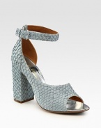 Elegant d'Orsay design in allover textured perch leather with an adjustable ankle strap and extra set of clear straps. Self-covered heel, 4 (100mm)Perch leather and PVC upperIncludes an extra set of clear strapsLeather lining and solePadded insoleImported