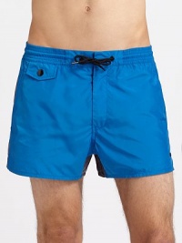 Classic fit, two-toned color trunks in quick-dry nylon.Elastic drawstring waistFront flap and back welt pocketsPolyesterMachine washImported Classic fit, two-toned color trunks in quick-dry nylon.Elastic drawstring waistFront flap and back welt pocketsPolyesterMachine washImported