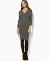 A classic sweater dress is knit in ultra-soft merino wool for season-spanning style.