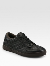 Classic low-top silhouette fashioned in a sleek, intricately woven design.Leather upperPadded insoleRubber soleMade in Italy Classic low-top silhouette fashioned in a sleek, intricately woven design.Leather upperPadded insoleRubber soleMade in Italy