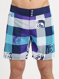 Bold, colorful plaid swim trunks with graphic detail in quick-drying nylon.Elastic waistBack flap pocketInseam, about 7PolyesterMachine washImported Bold, colorful plaid swim trunks with graphic detail in quick-drying nylon.Elastic waistBack flap pocketInseam, about 7PolyesterMachine washImported