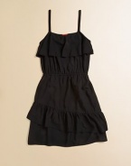 Large ruffles adorn the A-line silhouette of this LBD for your little girl.Ruffled scoopneckSleevelessPullover styleElastic waistFull skirt100% rayonHand washMade in USA