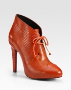 Lace-up ankle boot of richly hued leather has a towering heel and lizard-print leather trim. Self-covered heel, 5 (125mm)Leather and lizard-print leather upperLeather lining and solePadded insoleImportedOUR FIT MODEL RECOMMENDS ordering one half size up as this style runs small. 