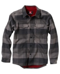 A deep red lining on this Cruser flannel gives this neutral-tone flannel from Quiksilver a modern touch. A deep red lining on this Cruser flannel gives this neutral-tone flannel from Quiksilver a modern touch.
