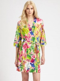 Eye-popping florals in vibrant hues cover this silky-smooth wrap. V-neckThree-quarter length sleevesSelf-tie waistAbout 35 from shoulder to hem92% polyester/8% spandexMachine washImported