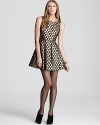 Frock around the clock in a flared VINCE CAMUTO party dress, flecked with gilded polka dots for 24-7 spotlight style. Juxtapose the feminine silhouette with a structured leather jacket for a rocker-luxe look.