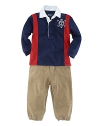 A long-sleeved cotton rugby shirt is paired with a classic cargo pant and finished with USA embroidery for authentic sporting style. A long-sleeved cotton rugby shirt is paired with a classic cargo pant and finished with USA embroidery for authentic sporting style.