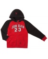Whether he is an aspiring basketball star or a fan of one of the greats, your little athlete will show his true love for the sport with this classic zip hoodie from Nike Jordan.