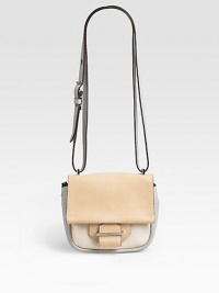 A petite crossbody design tailored from supple leather makes a chic accent for everyday wear.Adjustable crossbody strap, 24-26 drop Snap flap closure One outside open pocket One inside zip pocket One inside open pocket Fully lined 7W X 6H X 2D Imported A petite crossbody design tailored from supple leather makes a chic accent for everyday wear.Adjustable crossbody strap, 24-26 drop Snap flap closure One outside open pocket One inside zip pocket One inside open pocket Fully lined 7W X 6H X 2D Imported