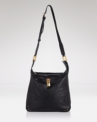 In a swingy shape, Marc Jacob's black leather shoulder bag defines simple-chic. Master off-duty cool and wear this style draped over a utilitarian coat, pull on moto boots for an extra edge. In a swingy shape, Marc Jacob's black leather shoulder bag defines simple-chic. Master off-duty cool and wear this style draped over a utilitarian coat, pull on moto boots for an extra edge.