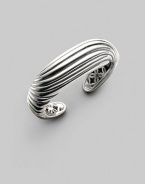 A sensuously curved fluted cuff of polished sterling silver is a fresh take on Yurman's signature cable. Sterling silver Diameter, about 2¼ Width, about 1 Imported