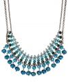 A pretty palette of blue ombre glass beads (4-10 mm) decorate this chic frontal necklace from c.A.K.e. by Ali Khan. Crafted in gold tone mixed metal. Approximate length: 14 inches + 3-inch extender. Approximate drop: 1-3/4 inches.