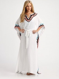A linen-blend design with multi-colored trim for an exotic feel and self-tie waistline for a flattering fit.V-neckPull-on styleSelf-tie55% linen/45% viscoseDry cleanMade in USA of imported fabric A linen-blend design with multi-colored trim for an exotic feel and self-tie waistline for a flattering fit.V-neckPull-on styleSelf-tie55% linen/45% viscoseDry cleanMade in USA of imported fabric