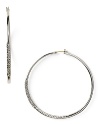 This pair of silvery hoop earrings from ABS by Allen Schwartz are a classic choice with a hint of glamour. Wear them to add subtle shimmer day to night.