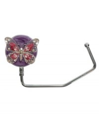Keep your purse secure (you'll know where it is at all times) and clean (off the floor) with this Purse hanger for the table--simply hang on the edge of any table at a restaurant, office or at home. Keep your purse secure (you'll know where it is at all times) and clean (off the floor) with this Purse hanger for the table--simply hang on the edge of any table at a restaurant, office or at home.