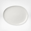 Borrowing from nature, this Pebblestone platter is metaphorically contoured and highly glossed in straightforward colors. The silhouette, a DVF signature, makes tables shine. Create interesting contrasts or pair with perfect matches.