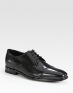 Distinguished leather lace-up with cap-toe finish.Leather upperPadded insoleRubber soleImported