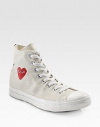 This canvas classic sports an eye-catching heart at the ankle and a contrast stripe at the heel. Rubber toe Lace-up front Painted heart on side Back stripe Padded insole Rubber sole Imported
