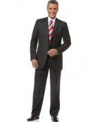 Searching for a look that's at once classic and cutting-edge? Look no further than this sleek solid charcoal suit from Tasso Elba.