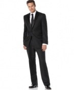 Elegantly simple, this sophisticated two-button tuxedo is a classic choice for black-tie affairs. Traditionally tailored, the jacket features satin-covered buttons, a notched satin lapel, chest welt pocket and front flap pockets with satin besoms. No back vent. Double reverse-pleated pant has on-seam pockets, suspender buttons instead of belt loops and satin braids on the side seam. Back besom pockets.