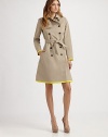 This classic trench style is trimmed with vibrant piping in an on-trend hue.Foldover collarGunflapDouble-breasted button frontSelf beltSide slash pocketsContrast trimBack rainflapFully linedAbout 37 from shoulder to hem82% cotton/18% silkDry cleanMade in France of imported fabricModel shown is 5'11 (180cm) wearing US size 4. 