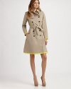 This classic trench style is trimmed with vibrant piping in an on-trend hue.Foldover collarGunflapDouble-breasted button frontSelf beltSide slash pocketsContrast trimBack rainflapFully linedAbout 37 from shoulder to hem82% cotton/18% silkDry cleanMade in France of imported fabricModel shown is 5'11 (180cm) wearing US size 4. 