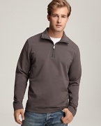 Long sleeve, half zip pullover with mockneck collar. Leather logo patch at bottom corner.