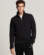 Long sleeve, French terry half zip with mockneck stand collar. Logo patch at bottom hem.