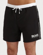 These handsome solid swim trunks sport a drawstring waistband and the classic BOSS logo.Elastic drawstring waistbandSide slash pocketsMesh liningInseam, about 6PolyamideMachine washImported