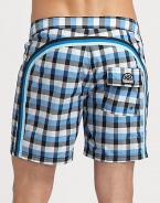 Quick-drying swim trunks, in a vivid check print, are accented by a lace-up waist and signature rainbow detail across the back and down the leg.Drawstring waistRear flap pocketInseam, about 7NylonMachine washImported