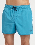 With stitched details and a grip-tape back patch pocket, these stylish swim trunks are both sporty and functional.Elastic drawstring waistStitch detail at flySlash side pocketsBack grip-tape patch pocketMesh liningPolyamidePolyester liningMachine washImported