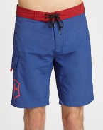 Contrasting waistband adds a splash of color to this all-time beach favorite.Drawstring tie waistSide cargo pocketInseam, about 9NylonMachine washImported