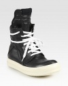 Lace-up leather high top design has a side zipper, unexpected wrap-around laces and subtle perforations at the toe. Rubber platform, 1 (25mm)Leather upperSide zipperLeather liningRubber solePadded insoleMade in ItalyOUR FIT MODEL RECOMMENDS ordering one half size up as this style runs small. 