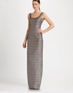 Striking and sculptural, tailored with bandage construction and crowned with a gorgeously beaded neckline.Beaded, banded scoopneckSleevelessBandage constructionConcealed back zipFully linedAbout 54 long80% rayon/20% metallicDry cleanImportedModel shown is 5'9 (175cm) wearing US size Small. 