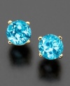 Simple, classic stud earrings with serene, crystal-clear blue topaz (5 mm). Round cut and prong set in lustrous 14k gold.