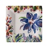 An opulent blue flower blooms from a backdrop of garden delights on the fresh, fun Eden candy plate from Gien France.