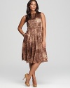 Exotics go executive as a sleek snakeskin print adorns the pleated silhouette of this Jones New York Collection Plus dress. Finish with nude pumps for a refined walk on the wild side.